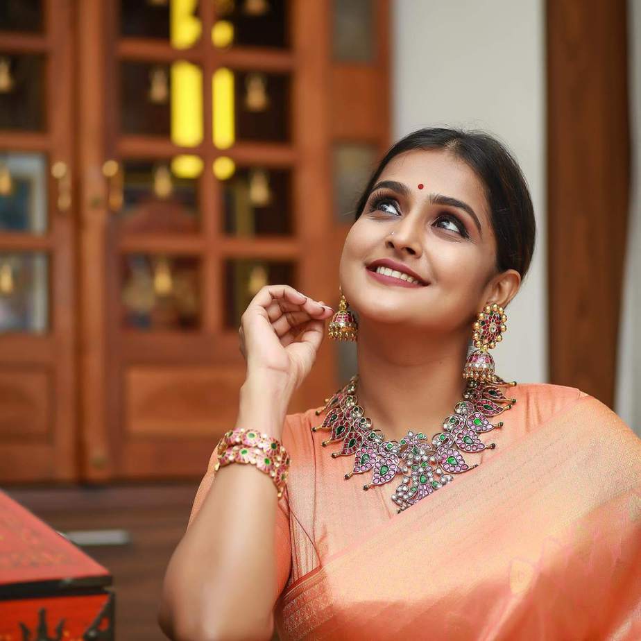 Ramya Nambessan in peach pattu saree by Devraagh 1 Ramya Nambessan in peach pattu saree by Devraagh-1
