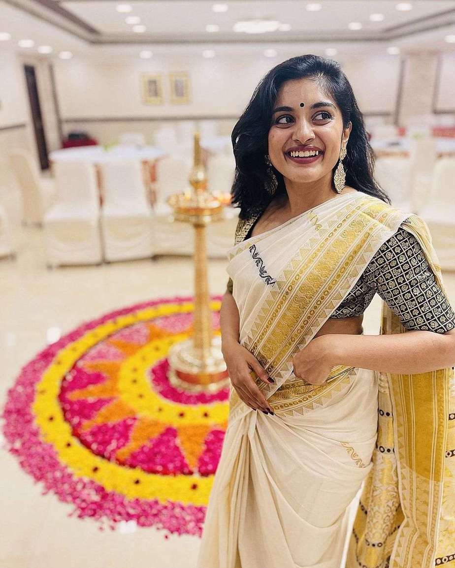 Nivetha Thomas in green tinged kasavu saree for onam 2021 Nivetha Thomas in green tinged kasavu saree for onam 2021