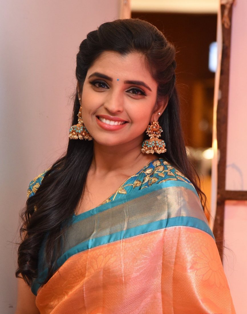 Syamala in a salmon pink pattu saree for style collections by Padma 1 Syamala in a salmon pink pattu saree for style collections by Padma-1