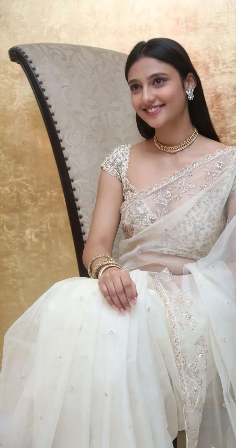 Ritika Yadav in an ivory organza saree at “AVAK” success meet! How to style a saree