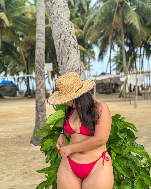 Nicole Faria looking stunning in a bold bikini pose.