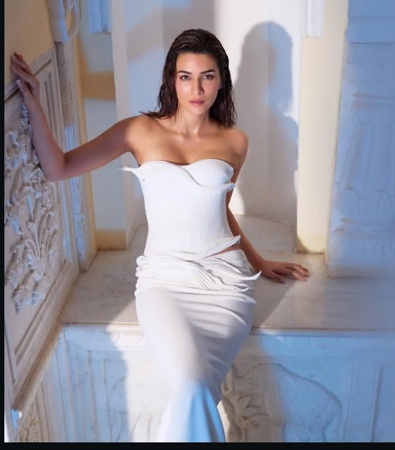 Kriti Sanon looking stunning in a beautifully designed white sculpted gown. Kriti Sanon looking stunning in a beautifully designed white sculpted gown.