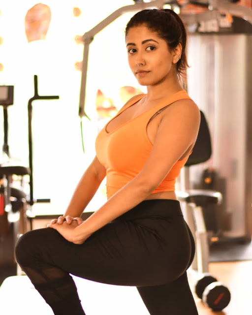 Yajnaseni striking a confident pose in stylish gym wear.
