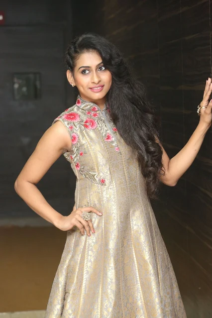 Nitya Naresh posing in sleeveless long dress, smiling