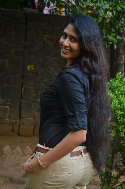 Aisha Azcym posing boldly in a black shirt Aisha Azcym posing boldly in a black shirt