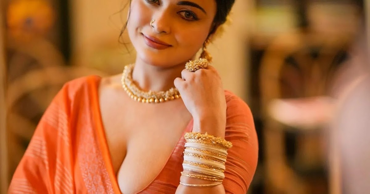 Mumtahina Jahan Hot Stills in Orange Saree and Deep Neck Blouse Celebrity Sarees