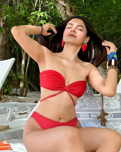 Sonali Arora in a vibrant red two-piece beachwear outfit