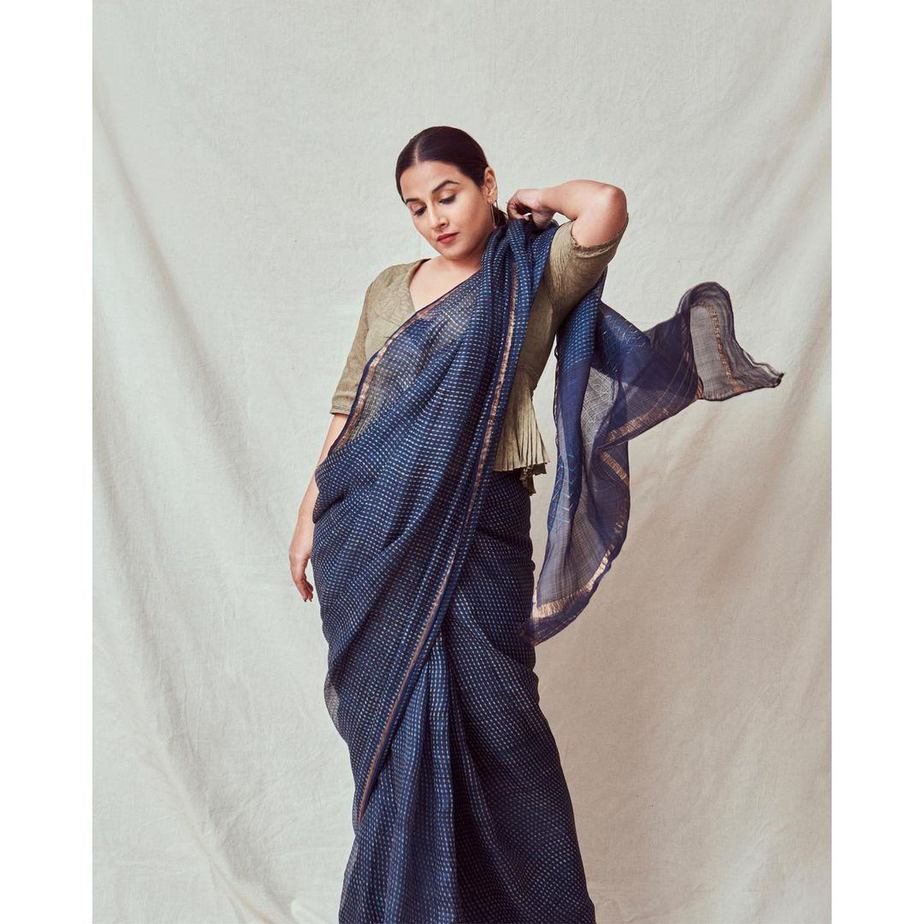 Vidya Balan pairs a handwoven saree with a peplum top! Vidya Balan pairs a handwoven saree with a peplum top! Vidya Balan
