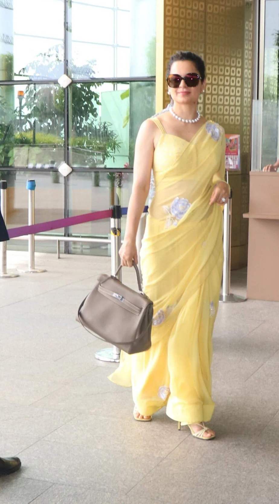 Airport Diaries: Kangana Ranaut in a simple pastel yellow saree! kangana ranaut in a saree