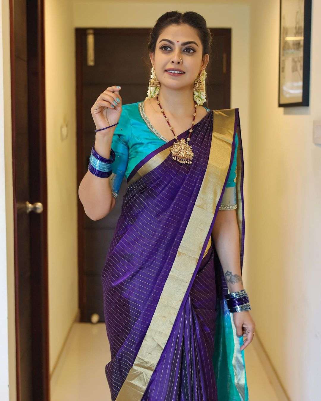 Anusree Nair in a blue striped silk saree! Anusree nair