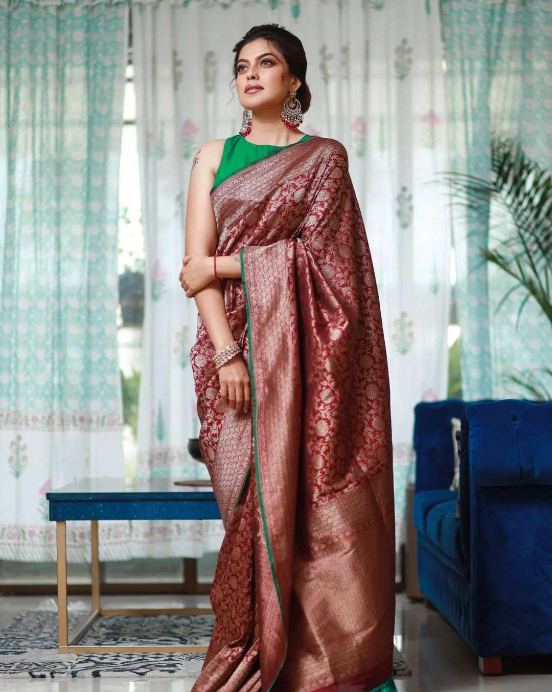 Anusree Nair pairs her red benarsi saree with a green blouse! Celebrity Sarees