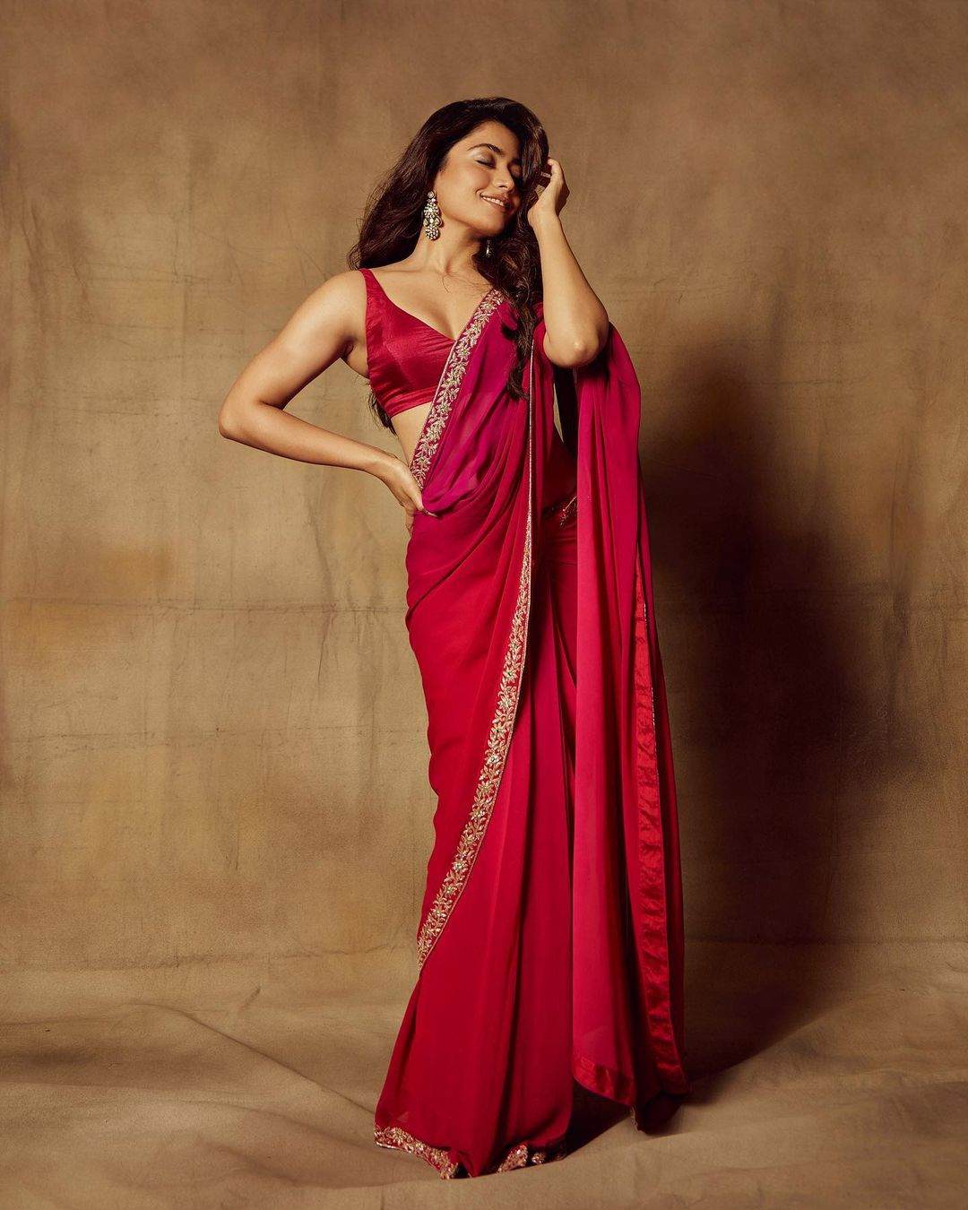 Rashmika Mandanna is a sight to behold in a magenta hand-embroidered saree! Rashmika Mandanna