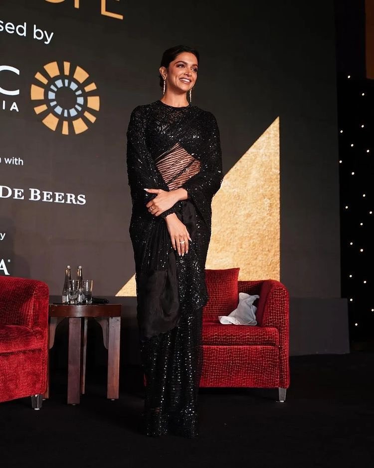 Deepika Padukone shimmers in a tulle bling saree at a charity event! Deepika Padukone