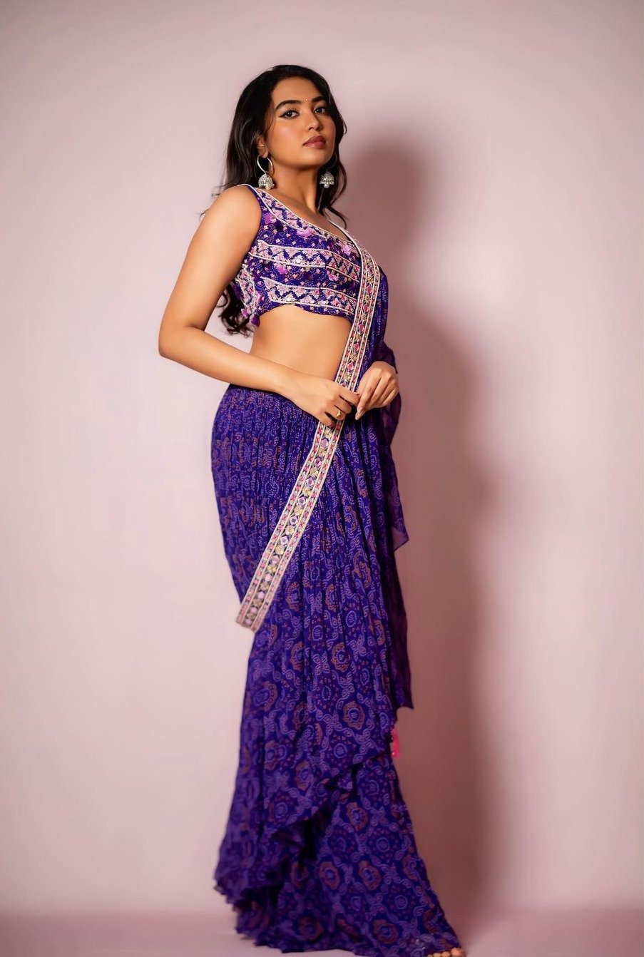 Shivathmika in a purple pre-draped saree at a wedding! Celebrity Sarees