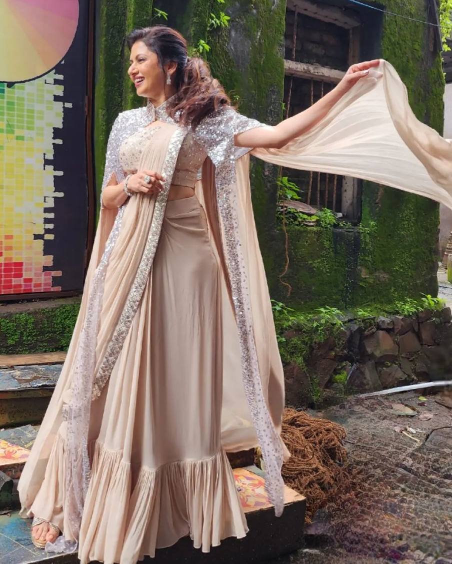 Bhagyashree raises style quotient in a cream ruffle saree with embellished cape! Celebrity Sarees
