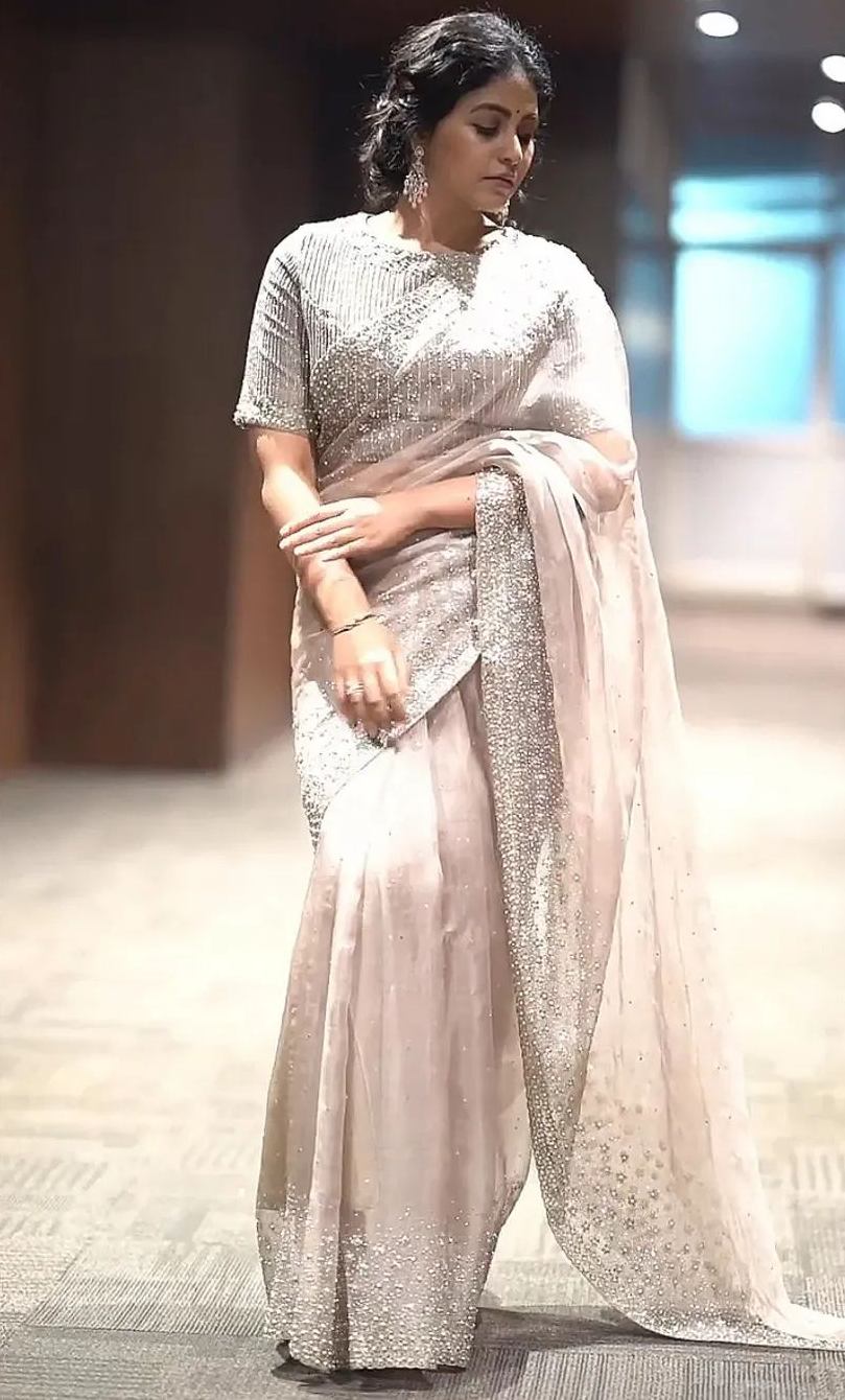 Anjali shimmers in a pastel pink embellished saree for an event! Anjali shimmers in a pastel pink embellished saree for an event! Anjali in a saree