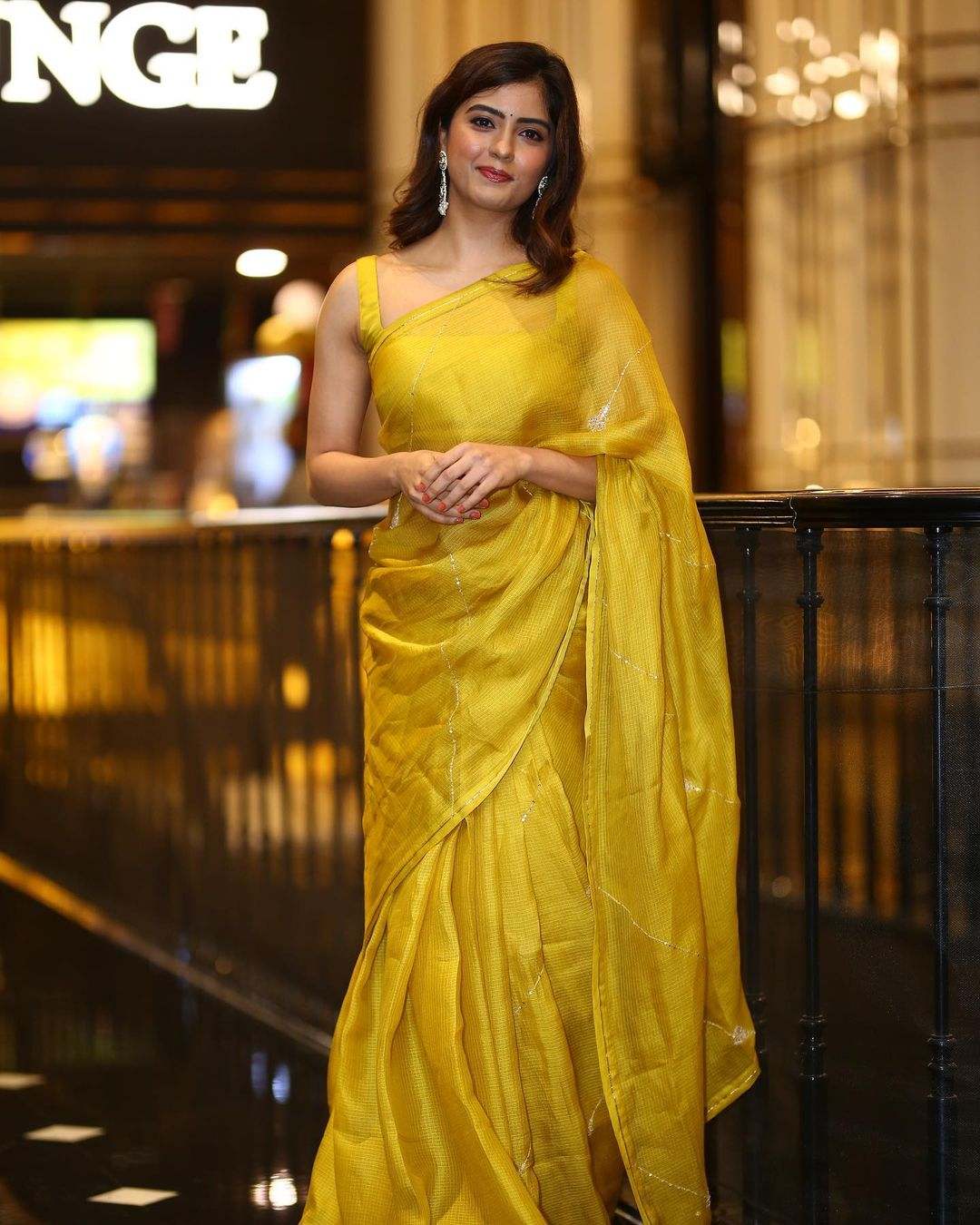 Amritha Aiyer looks radiant in a yellow organza saree for “Hanuman” teaser launch event! Celebrity Sarees