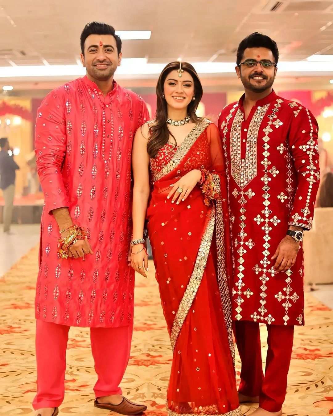 Hansika Motwani drapes on a red mirror work saree for her pre-wedding puja! Hansika