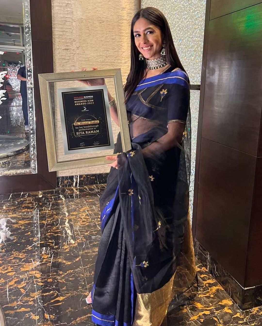Mrunal Thakur looks all things glam in a black organza saree at an award function! MRUNAL THAKUR IN A SAREE
