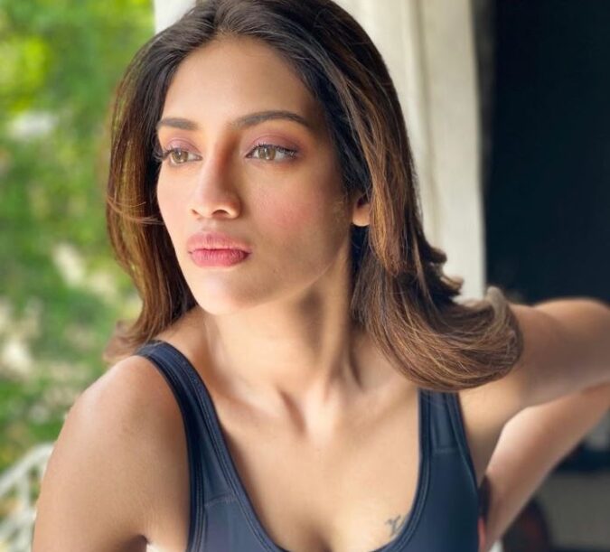 Nusrat Jahan Looks Stunning in Sleeveless Vest Latest Stills Celebrity Sarees